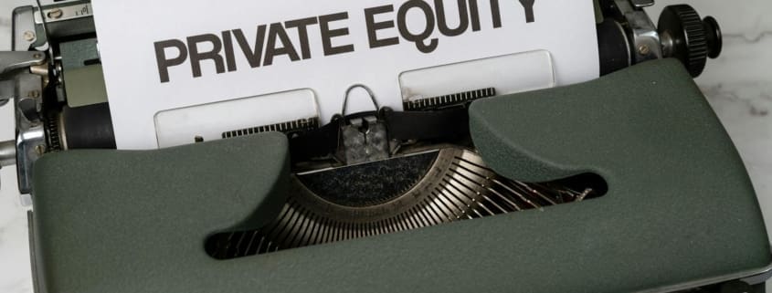 Close-up of vintage typewriter with 'PRIVATE EQUITY' on paper, business concept.