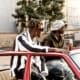 Stylish young men in Lagos, Nigeria, enjoying an urban setting in fashionable attire.